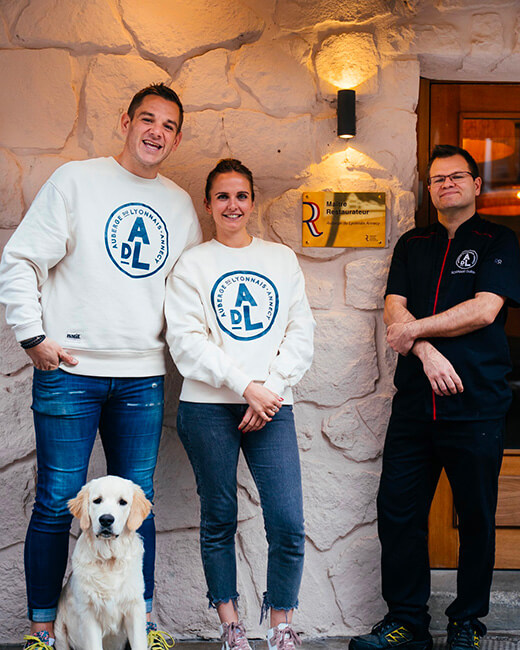 The current Auberge du Lyonnais team, with founders Camille and Charles, Pétrus the dog and chef Guillaume Roignant.